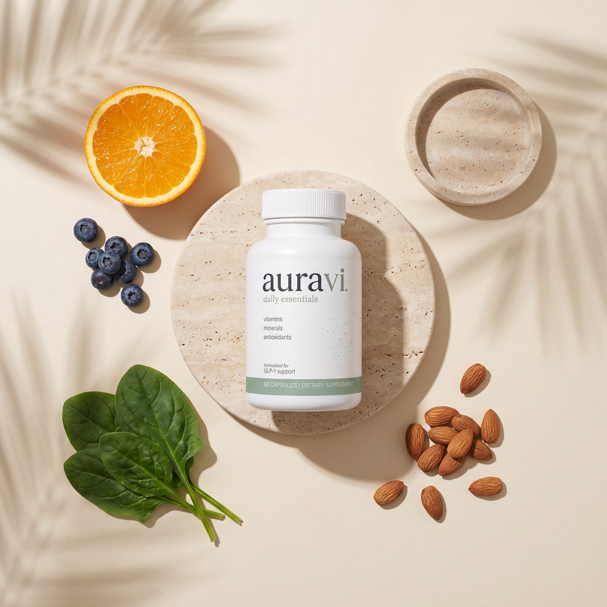 Daily Essentials flat-lay with fresh ingredients on travertine