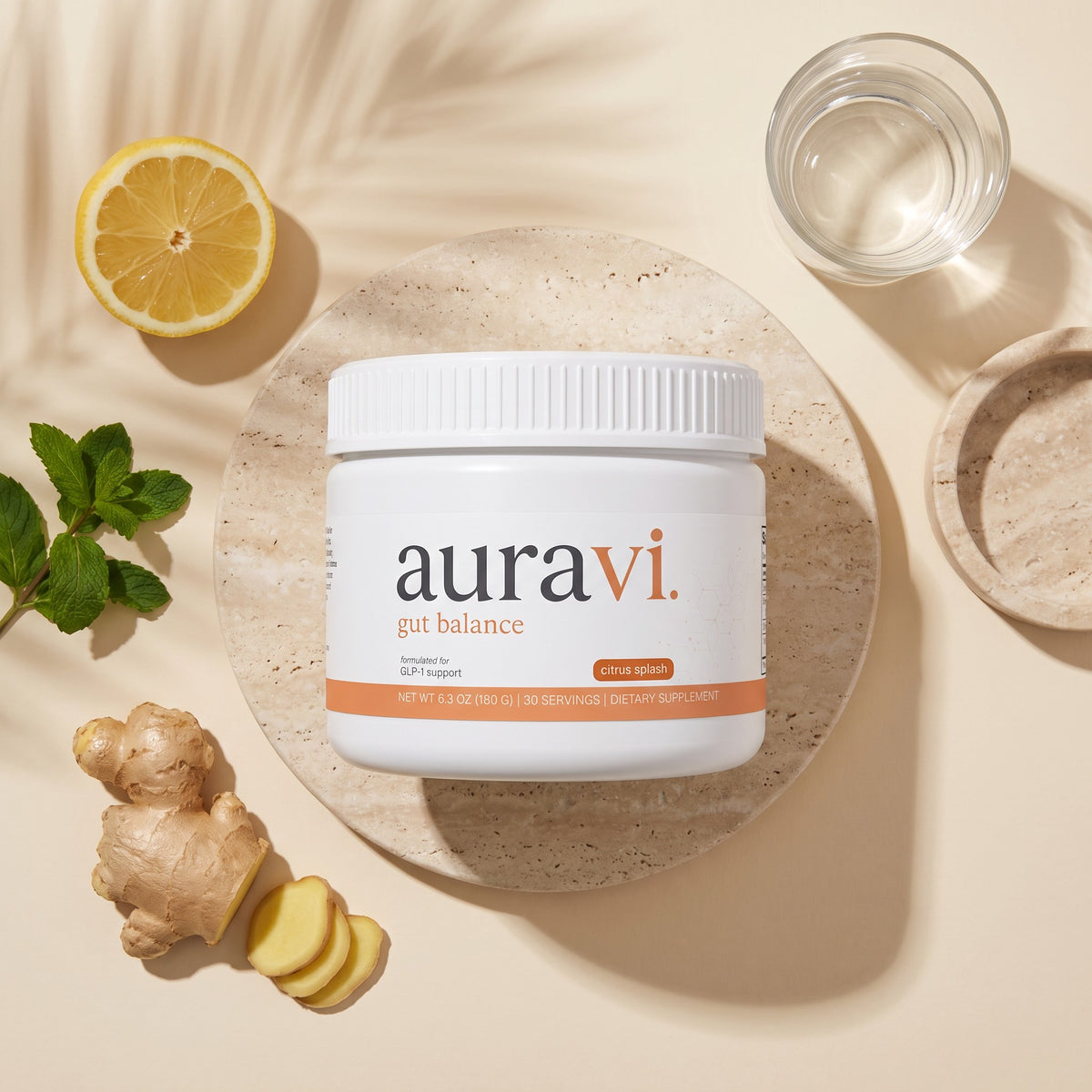 Gut Balance flat-lay with fresh ingredients on travertine