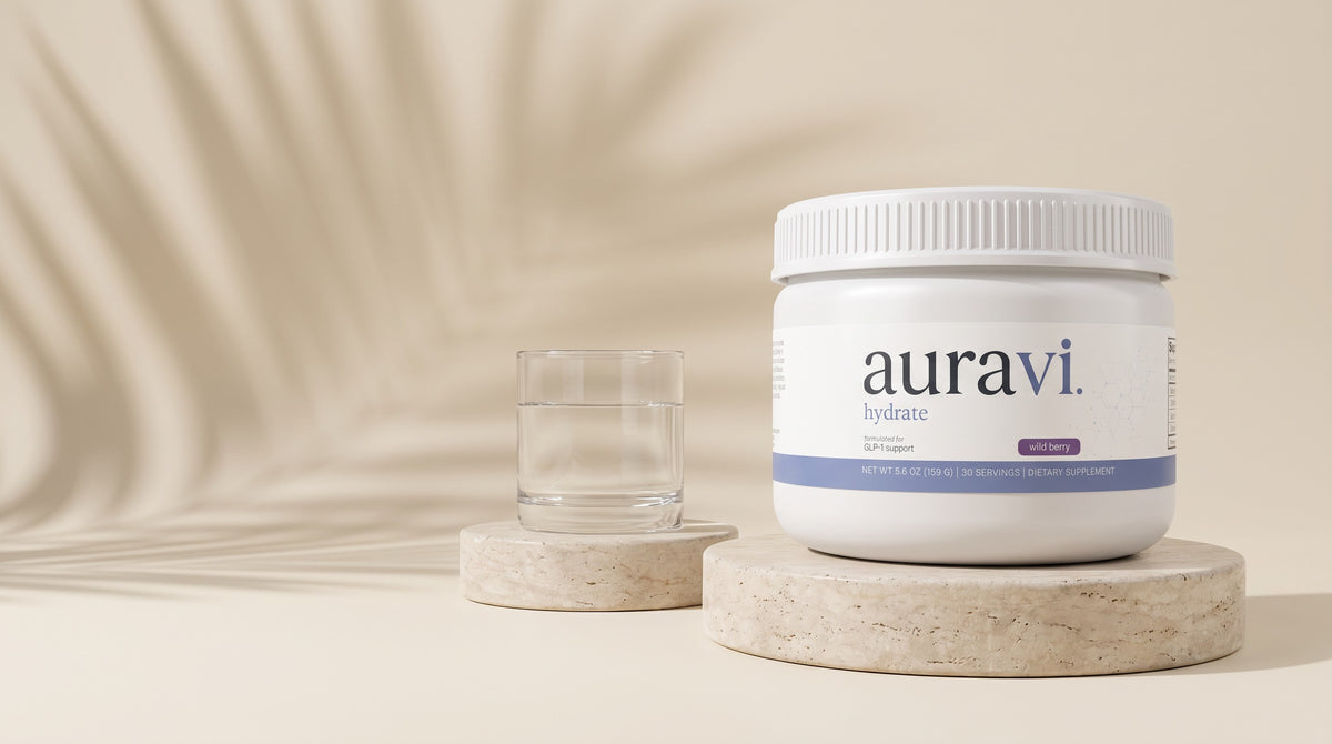Hydrate on a travertine plinth with a glass of water